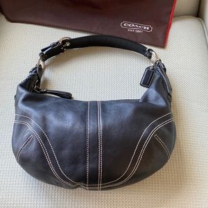 Coach leather hobo bag in black with white top stitching.